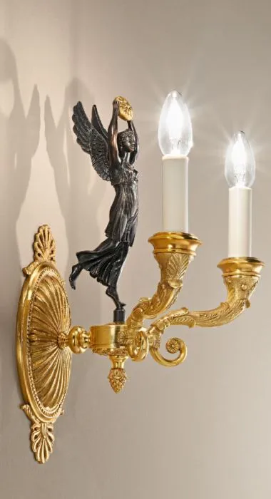 Gold Wall Sconce With Matte Dark Bronze Figurine Detail