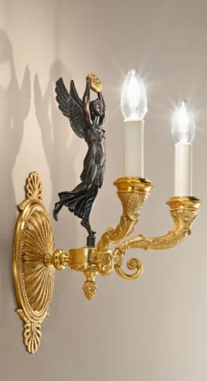 Gold Wall Sconce With Matte Dark Bronze Figurine Detail